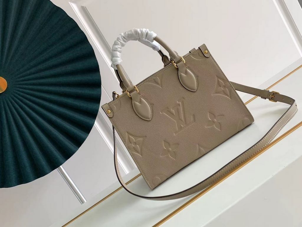 TopM45779 Handbag New ArrivalThe Onthego mini shopper showcases the Monogram pattern in all its glory, with large letters embossed on soft grained cowhide leather, ample interior to hold a laptop and other office essenti