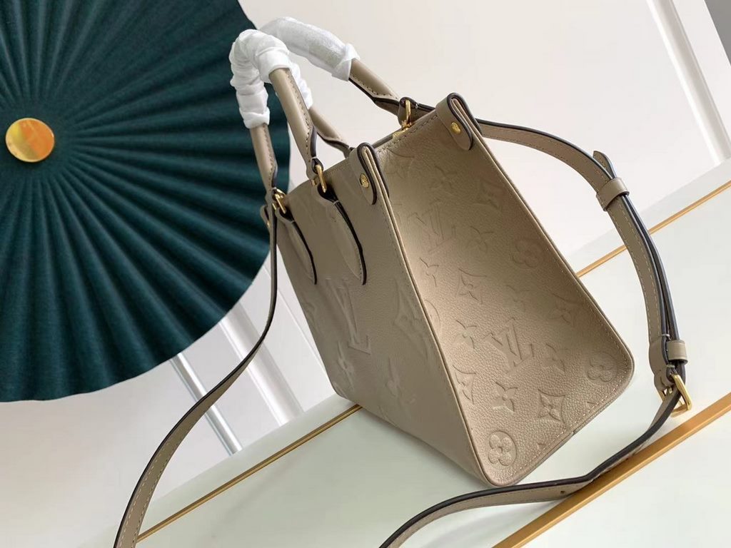 TopM45779 Handbag New ArrivalThe Onthego mini shopper showcases the Monogram pattern in all its glory, with large letters embossed on soft grained cowhide leather, ample interior to hold a laptop and other office essenti