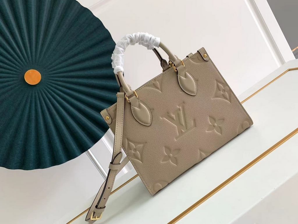 TopM45779 Handbag New ArrivalThe Onthego mini shopper showcases the Monogram pattern in all its glory, with large letters embossed on soft grained cowhide leather, ample interior to hold a laptop and other office essenti