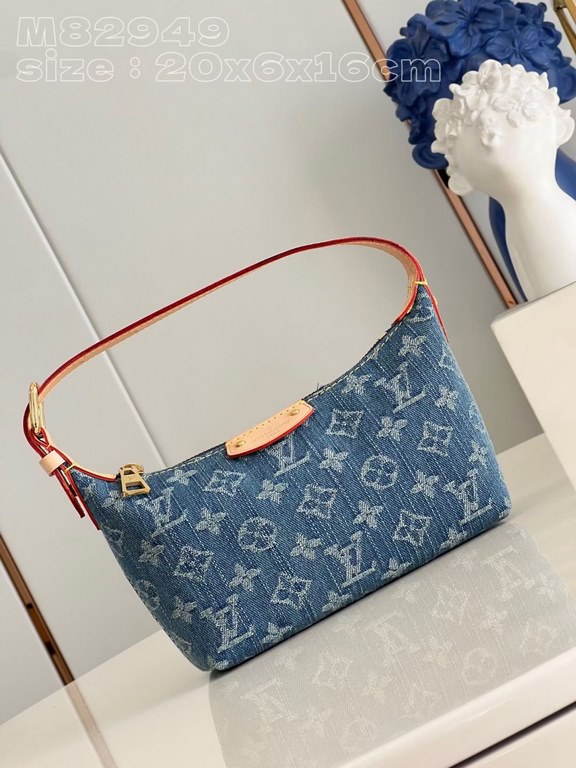 The M82949 Hills Pochette clutch is crafted from Monogram Denim canvas woven from certified denim cotton and finished with a sandwash texture to accentuate the sharp lines. With an adjustable shoulder strap for short-sho