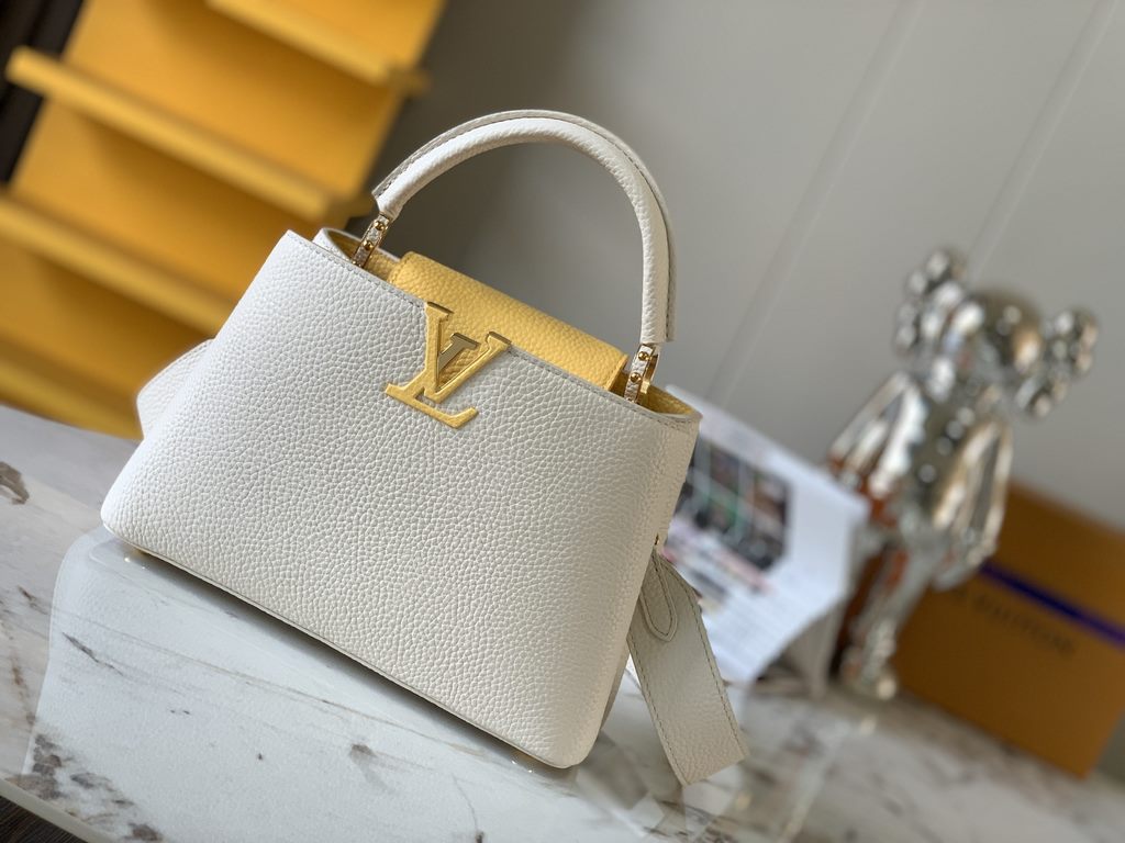 M59465 Pearl White with Pale Yellow Gold Buckle]A modern clash of shades in full-grain cowhide leather, this Capucines BB bag features the iconic LV alphabet and side loops, top handles and a detachable shoulder strap fo