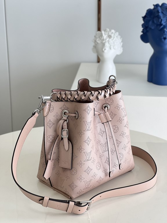 ExclusiveM58788 Pearlescent Pink] The Muria Bucket Bag is crafted from cutout cowhide leather that lends a metallic sheen to the perforated Monogram pattern, and is finished with a leather name tag and key holder. Explor