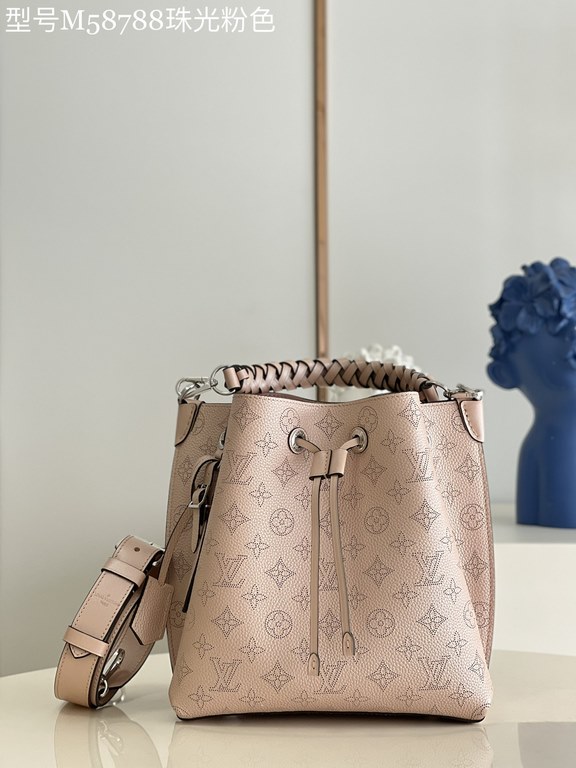 ExclusiveM58788 Pearlescent Pink] The Muria Bucket Bag is crafted from cutout cowhide leather that lends a metallic sheen to the perforated Monogram pattern, and is finished with a leather name tag and key holder. Explor