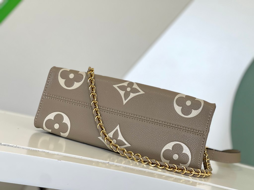 M23641 Gray Silk Screen  M23698 White  M23640 Black This OnTheGo small pouch is embossed with the Giant Monogram pattern in Monogram leather for a soft, slender silhouette. The compact interior organizes everyday essenti