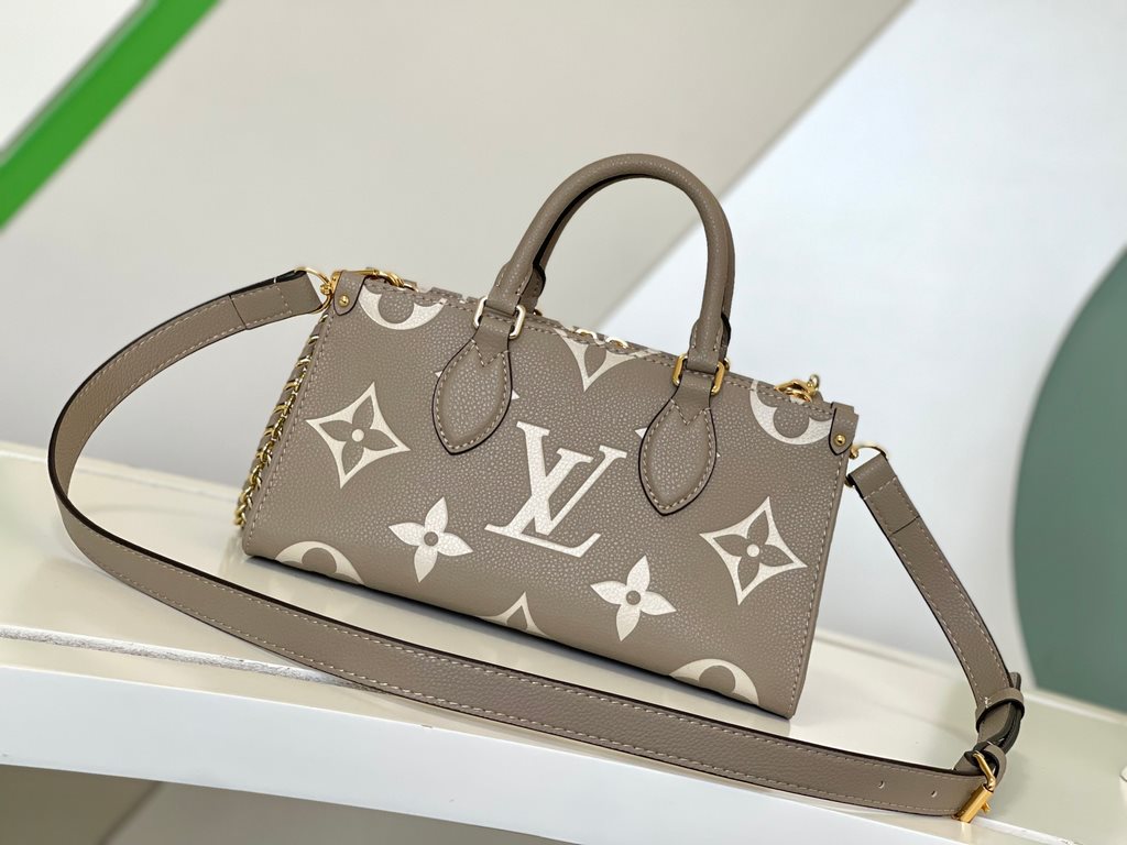 M23641 Gray Silk Screen  M23698 White  M23640 Black This OnTheGo small pouch is embossed with the Giant Monogram pattern in Monogram leather for a soft, slender silhouette. The compact interior organizes everyday essenti