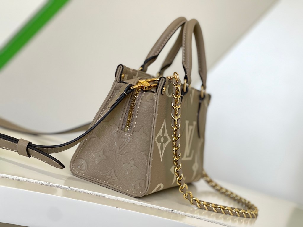 M23641 Gray Silk Screen  M23698 White  M23640 Black This OnTheGo small pouch is embossed with the Giant Monogram pattern in Monogram leather for a soft, slender silhouette. The compact interior organizes everyday essenti