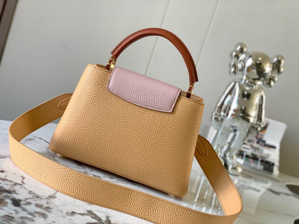 M59465 Apricot Yellow with Light Earth Gold Buckle]A modern clash of shades in full-grain cowhide leather, this Capucines BB bag features the iconic LV alphabet and side loops, top handles and a detachable shoulder strap