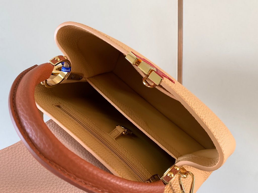 M59465 Apricot Yellow with Light Earth Gold Buckle]A modern clash of shades in full-grain cowhide leather, this Capucines BB bag features the iconic LV alphabet and side loops, top handles and a detachable shoulder strap