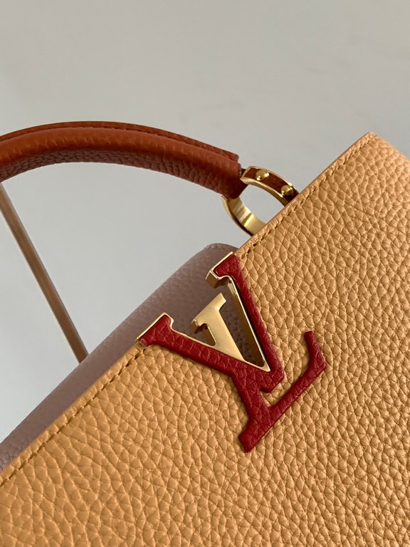 M59465 Apricot Yellow with Light Earth Gold Buckle]A modern clash of shades in full-grain cowhide leather, this Capucines BB bag features the iconic LV alphabet and side loops, top handles and a detachable shoulder strap