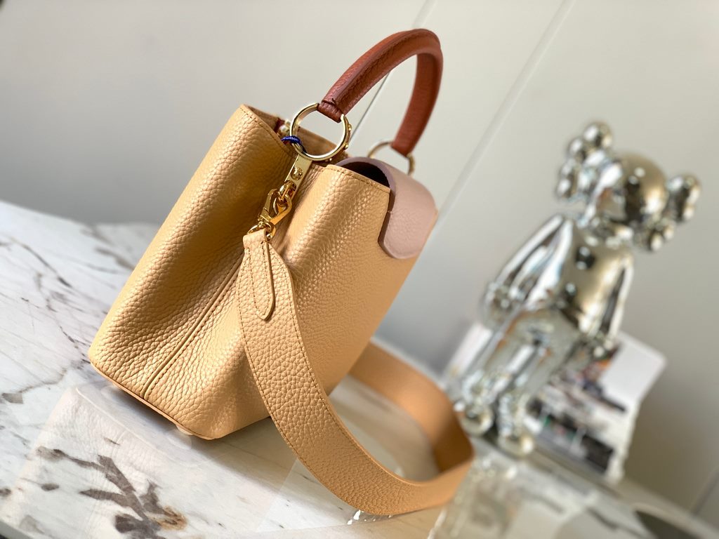 M59465 Apricot Yellow with Light Earth Gold Buckle]A modern clash of shades in full-grain cowhide leather, this Capucines BB bag features the iconic LV alphabet and side loops, top handles and a detachable shoulder strap