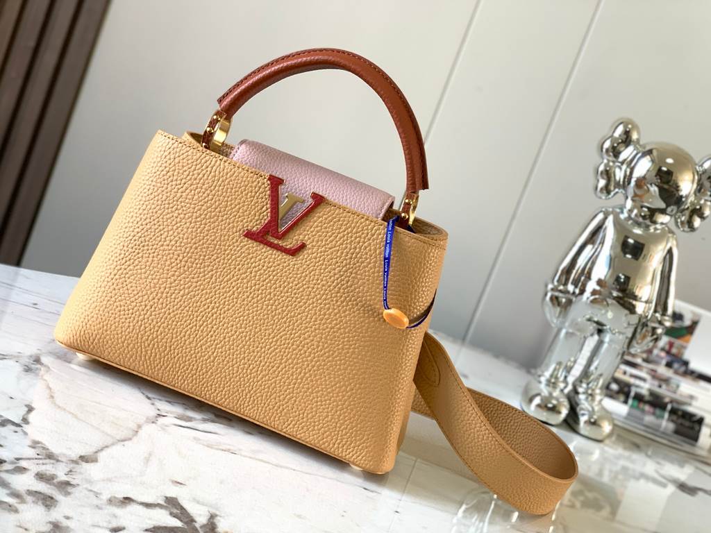 M59465 Apricot Yellow with Light Earth Gold Buckle]A modern clash of shades in full-grain cowhide leather, this Capucines BB bag features the iconic LV alphabet and side loops, top handles and a detachable shoulder strap