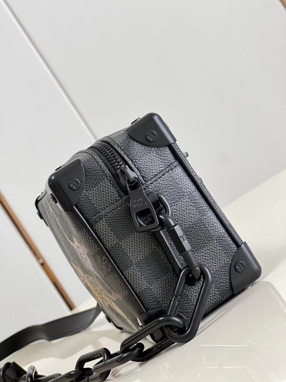 Top  Model No.N45278# The Mini Soft Trunk is a wildlife-inspired design on Damier Graphite canvas, with a passport-stamped texture that's visible up close. The squared-off shape and reinforced corners are a nod to the br