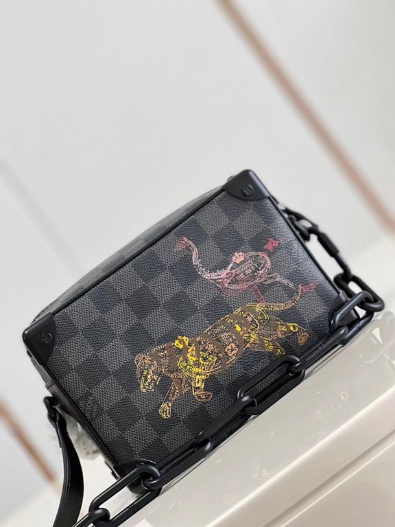 Top  Model No.N45278# The Mini Soft Trunk is a wildlife-inspired design on Damier Graphite canvas, with a passport-stamped texture that's visible up close. The squared-off shape and reinforced corners are a nod to the br