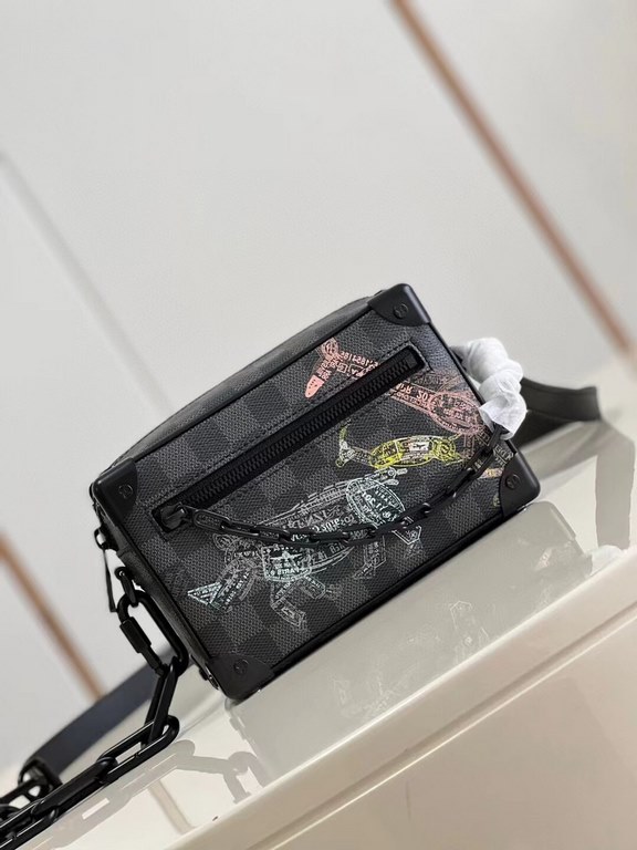 Top  Model No.N45278# The Mini Soft Trunk is a wildlife-inspired design on Damier Graphite canvas, with a passport-stamped texture that's visible up close. The squared-off shape and reinforced corners are a nod to the br