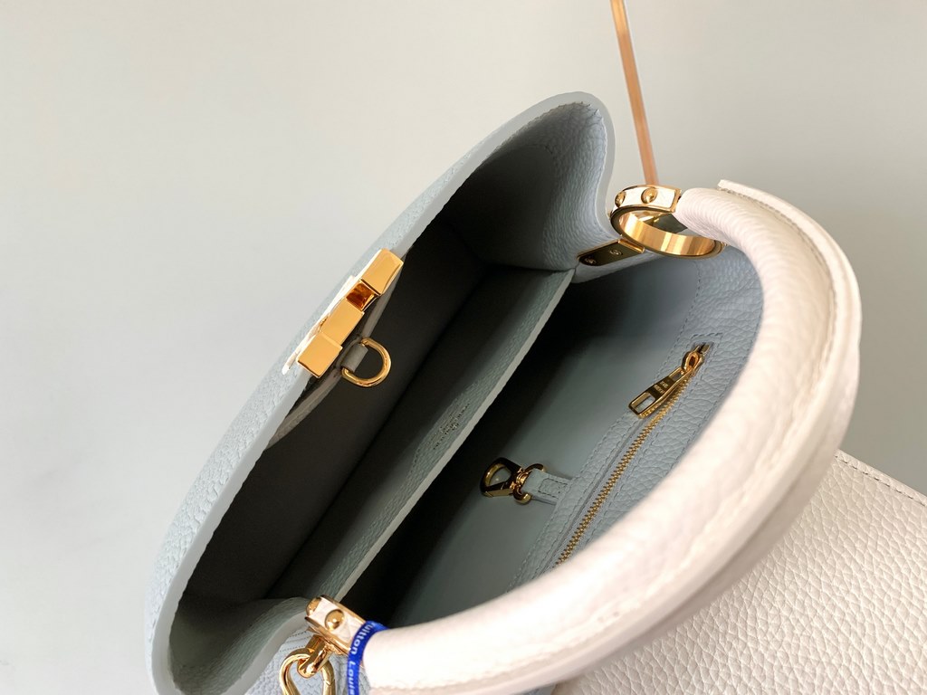 M59465 Minaret Gray with Pearl Platinum Buckle]A modern clash of shades in full-grain cowhide leather, this Capucines BB bag features the iconic LV alphabet and side loops, top handles and a detachable shoulder strap for