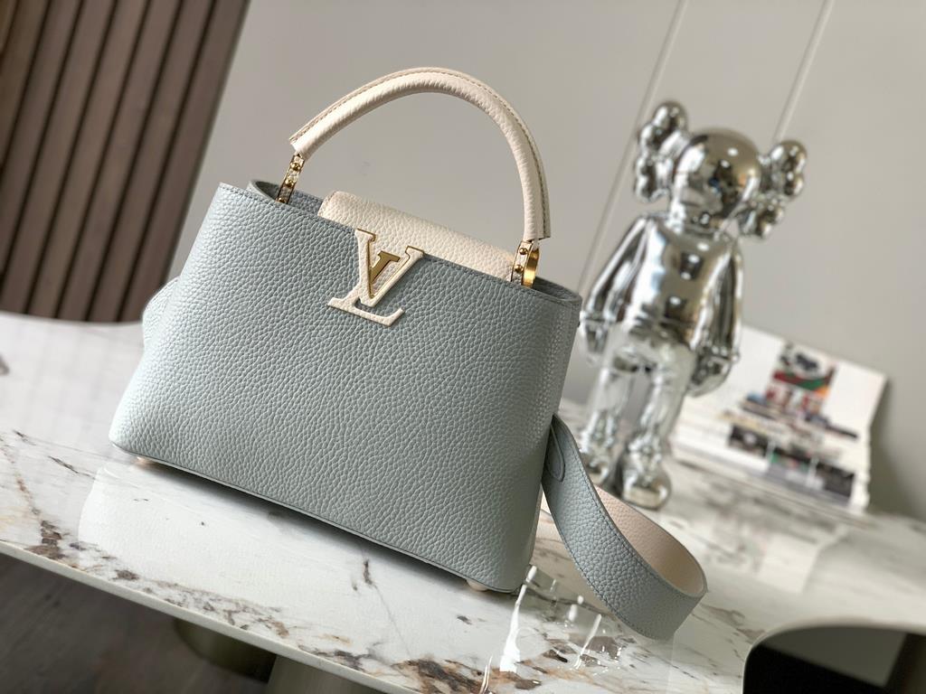 M59465 Minaret Gray with Pearl Platinum Buckle]A modern clash of shades in full-grain cowhide leather, this Capucines BB bag features the iconic LV alphabet and side loops, top handles and a detachable shoulder strap for