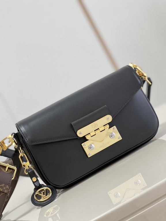 TopThe M20393 Swing bag in black was presented on the SpringSummer 2022 runway and is based on Louis Vuitton's Pochette Métis bag, an on-trend reinterpretation of the long and slender bag. The classic S-lock closure exte