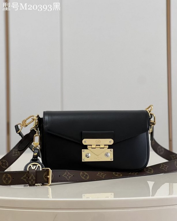 TopThe M20393 Swing bag in black was presented on the SpringSummer 2022 runway and is based on Louis Vuitton's Pochette Métis bag, an on-trend reinterpretation of the long and slender bag. The classic S-lock closure exte