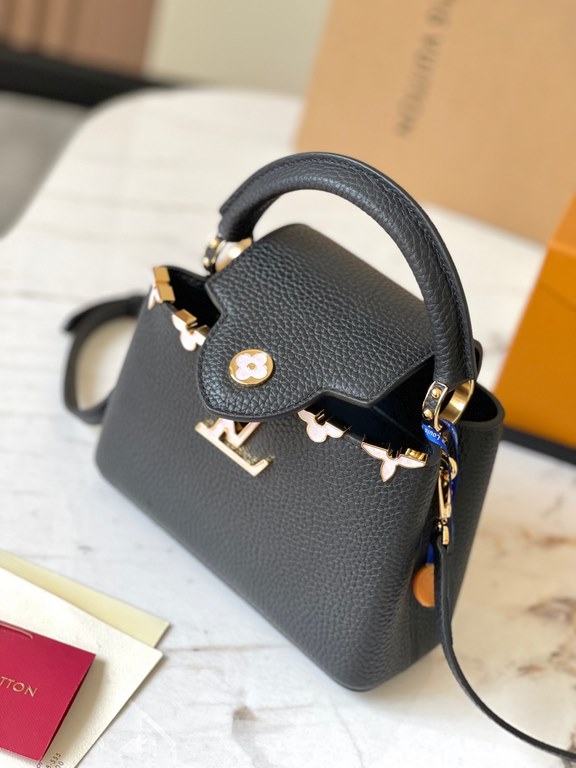 Capucines Flower Crown handbag in full grain Taurillon leather with Monogram flowers.Capucines mini handbag, this Capucines Flower Crown handbag is full grain Taurillon leather embellished with Monogram flowers, each sha