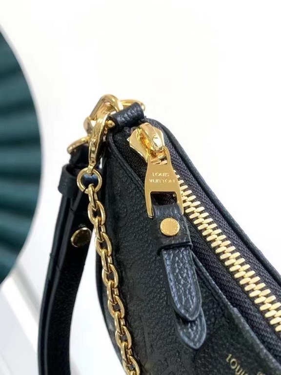 SpecialtyM81066 M80349 The Spring 2022 Easy Pouch On Strap is crafted from Monogram Empreinte leather with Monogram embossing and a soft texture. The chain and adjustable leather shoulder strap make it easy to carry on t