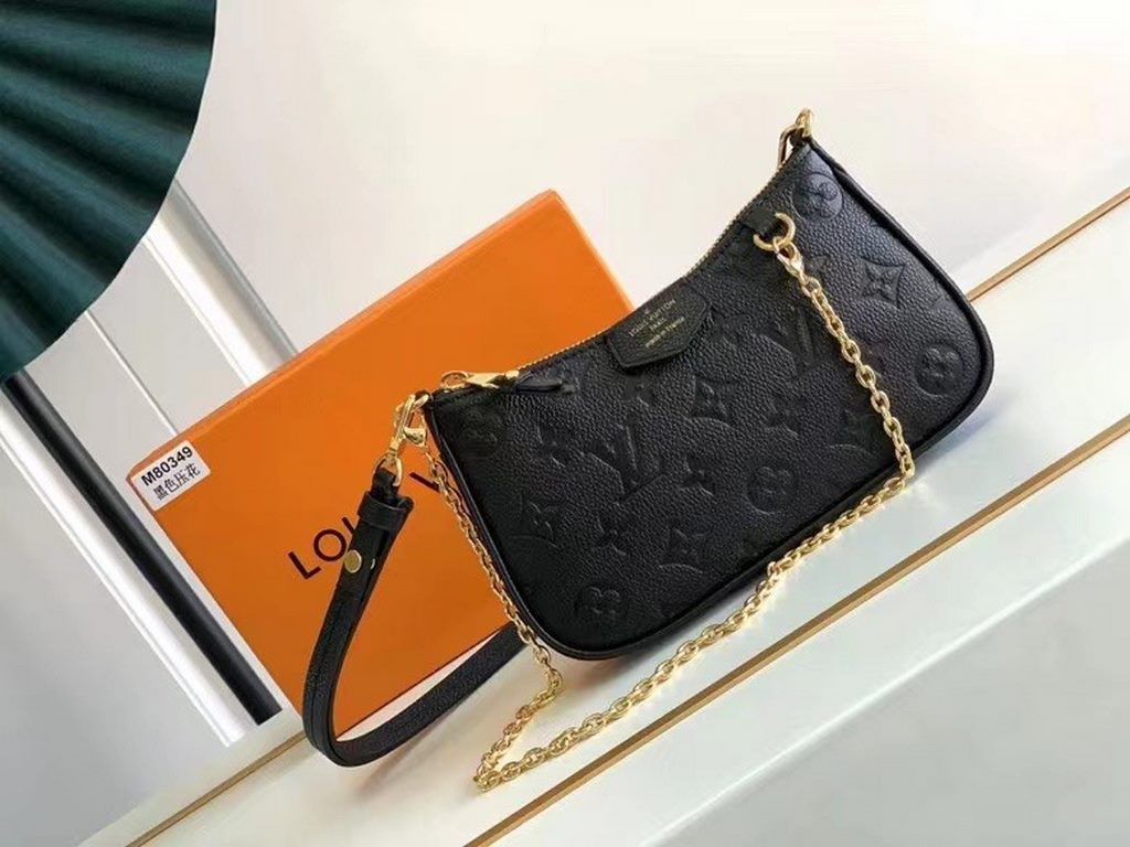 SpecialtyM81066 M80349 The Spring 2022 Easy Pouch On Strap is crafted from Monogram Empreinte leather with Monogram embossing and a soft texture. The chain and adjustable leather shoulder strap make it easy to carry on t