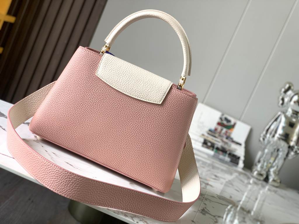 M59466 Rose Pink with Pearl Platinum Buckle]A modern clash of shades in full-grain cowhide leather, this medium Capucines bag features the iconic LV alphabet and side loops, top handles and a detachable shoulder strap fo