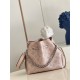 SpecialtyM58791 Pearlescent Pink] M58792 M57068 M57201 The Bella Bucket Bag is crafted from cut-out cowhide leather with a metallic sheen that accentuates the perforated Monogram pattern. The sleek silhouette and round-n