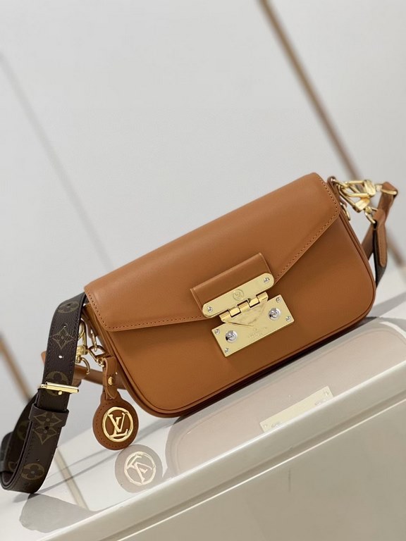 TopThe M20393 Brown M20396 Swing bag was unveiled on the SpringSummer 2022 runway, with an on-trend reinterpretation of Louis Vuitton's Pochette Métis bag, a long and slender bag. The classic S-lock closure extends its p