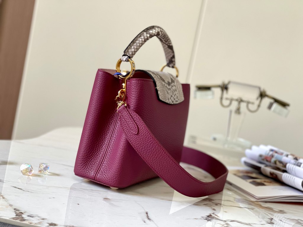 PremiumN82068 Grape Purple with Parisian Pink Python and Gold Buckle].In grained Taurillon leather with python flap, top handle and LV monogram, this Capucines BB bag has a luxurious feel. The contrasting light-colored l