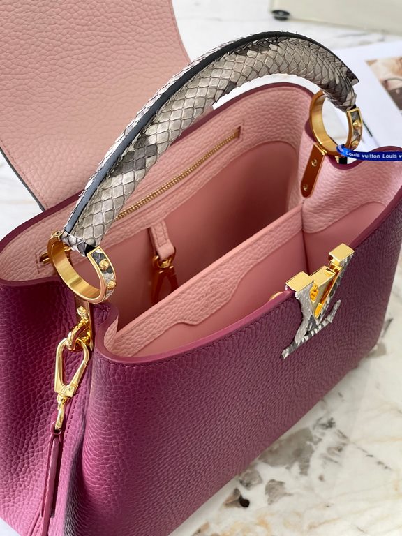 PremiumN82068 Grape Purple with Parisian Pink Python and Gold Buckle].In grained Taurillon leather with python flap, top handle and LV monogram, this Capucines BB bag has a luxurious feel. The contrasting light-colored l