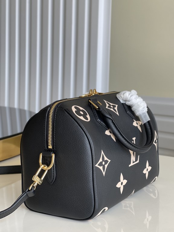 Exclusive to M58947] The Speedy Bandoulière 25 bag from the Fall 2021 Wild at Heart capsule collection features oversized LV letters embossed in Monogram Empreinte leather and a detachable shoulder strap for a crossbody 