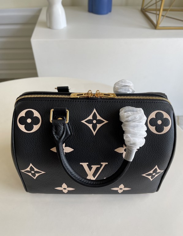 Exclusive to M58947] The Speedy Bandoulière 25 bag from the Fall 2021 Wild at Heart capsule collection features oversized LV letters embossed in Monogram Empreinte leather and a detachable shoulder strap for a crossbody 