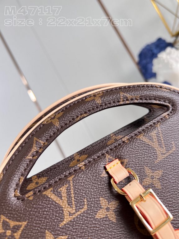 Top [Exclusive M47117] This Around Me bag is made from Monogram-coated canvas, inspired by the LV Circle logo. The logo was created in the 1920s and is featured in Louis Vuitton stores and advertisements. The rounded bag