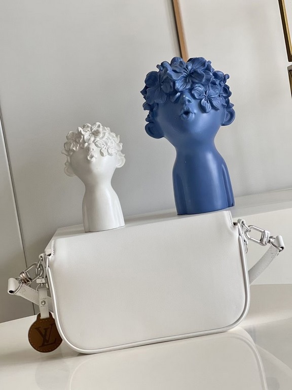 TopThe M20393 White Swing bag was unveiled on the SpringSummer 2022 runway, with a long and slender design based on the Louis Vuitton Pochette Métis bag. The classic S-lock closure extends its proportions, while the shor