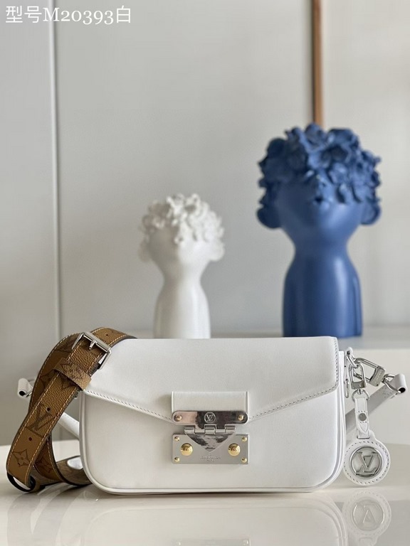 TopThe M20393 White Swing bag was unveiled on the SpringSummer 2022 runway, with a long and slender design based on the Louis Vuitton Pochette Métis bag. The classic S-lock closure extends its proportions, while the shor