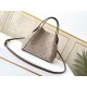 SpecialtyHINA small handbag with double design, with a spring buckle in the middle of the bag, foldable, stretchable, switch between a tote bag and a modern bucket bag, cut from calfskin leather with cut-outs, lightweigh