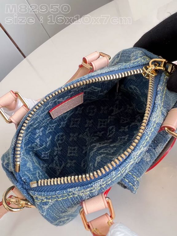 Exclusive to M82950] The Nano Speedy is made from Monogram Denim sandwashed canvas woven from certified cotton with leather handles and a detachable shoulder strap. The compact design features a slotted side pocket for a