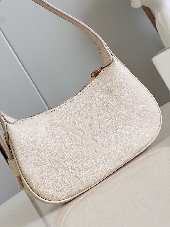 Exclusive M82391 White] The M82519 Mini Moon is crafted from supple Monogram Empreinte embossed leather, with eye-catching details such as the LV Circle logo on the zipper closure reflecting its jewel-like brilliance. Th