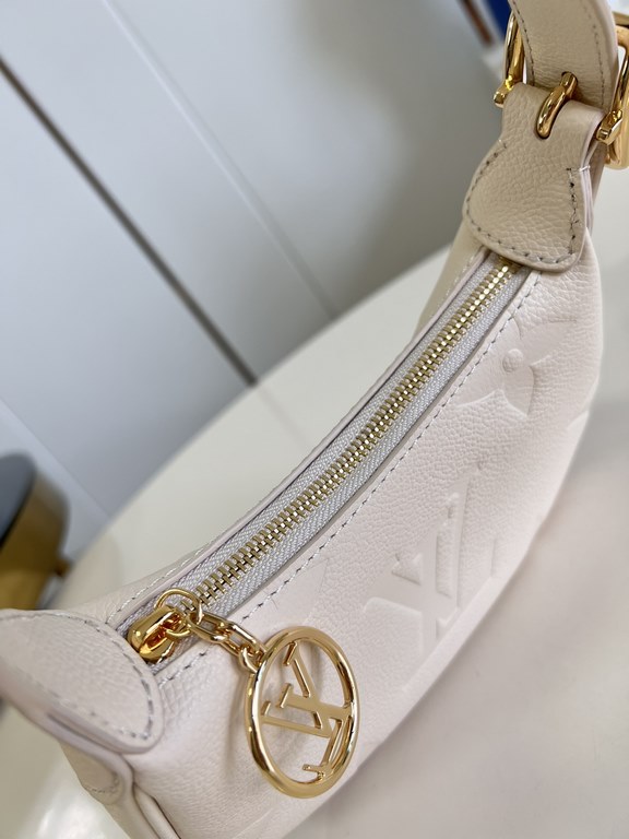 Exclusive M82391 White] The M82519 Mini Moon is crafted from supple Monogram Empreinte embossed leather, with eye-catching details such as the LV Circle logo on the zipper closure reflecting its jewel-like brilliance. Th