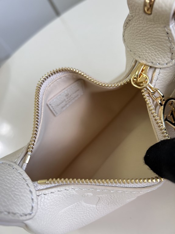 Exclusive M82391 White] The M82519 Mini Moon is crafted from supple Monogram Empreinte embossed leather, with eye-catching details such as the LV Circle logo on the zipper closure reflecting its jewel-like brilliance. Th