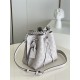 ExclusiveExclusive to M58788 in pearlized grey, this Muria bucket bag is crafted from cutout cowhide leather that lends a metallic sheen to the perforated Monogram pattern, and is finished with a leather name tag and key