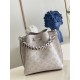 ExclusiveExclusive to M58788 in pearlized grey, this Muria bucket bag is crafted from cutout cowhide leather that lends a metallic sheen to the perforated Monogram pattern, and is finished with a leather name tag and key