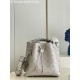 ExclusiveExclusive to M58788 in pearlized grey, this Muria bucket bag is crafted from cutout cowhide leather that lends a metallic sheen to the perforated Monogram pattern, and is finished with a leather name tag and key