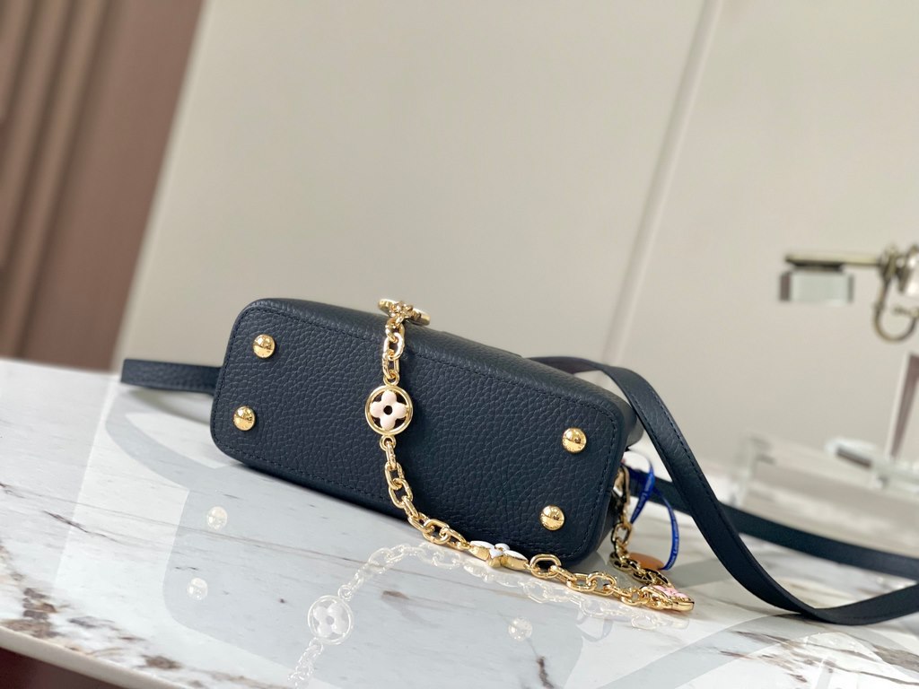 ExtraordinaryM20845 Black with Light Cherry Blossom Pink Floral TricotThis Capucines mini handbag is a soft and feminine piece a Taurillon leather body with a light-colored flap and top handle, and an enameled Monogram f