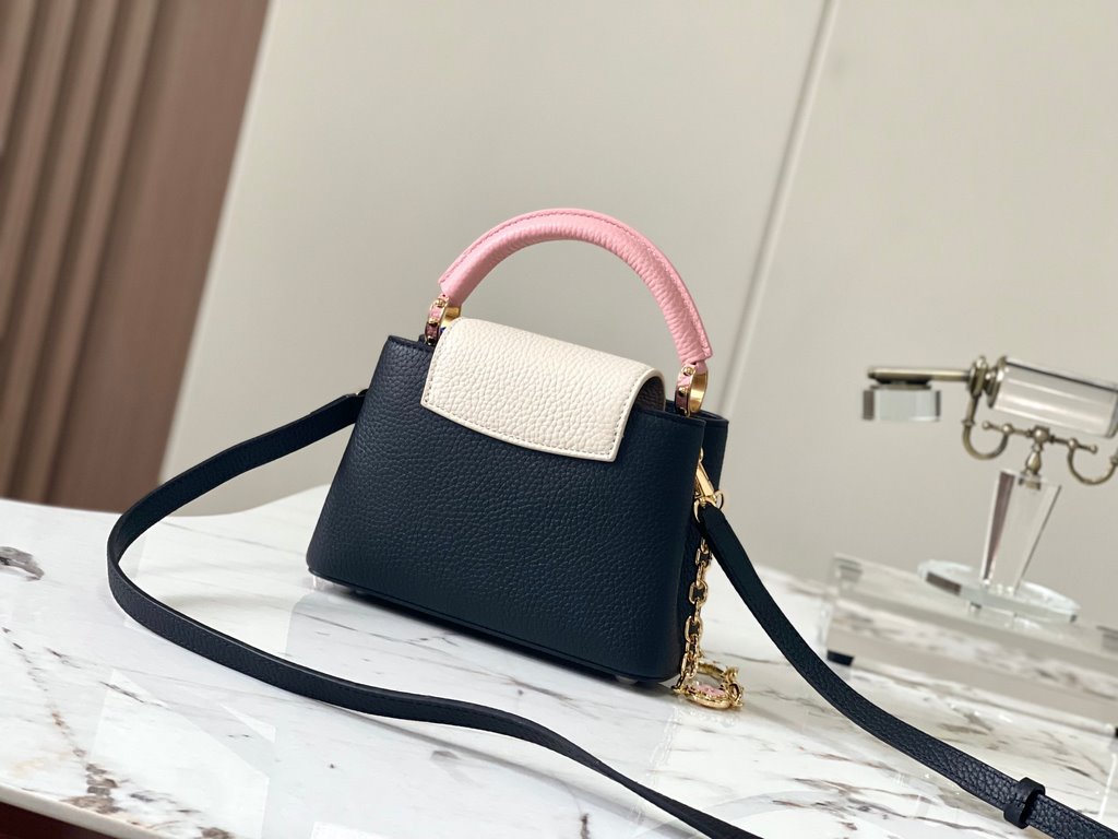 ExtraordinaryM20845 Black with Light Cherry Blossom Pink Floral TricotThis Capucines mini handbag is a soft and feminine piece a Taurillon leather body with a light-colored flap and top handle, and an enameled Monogram f