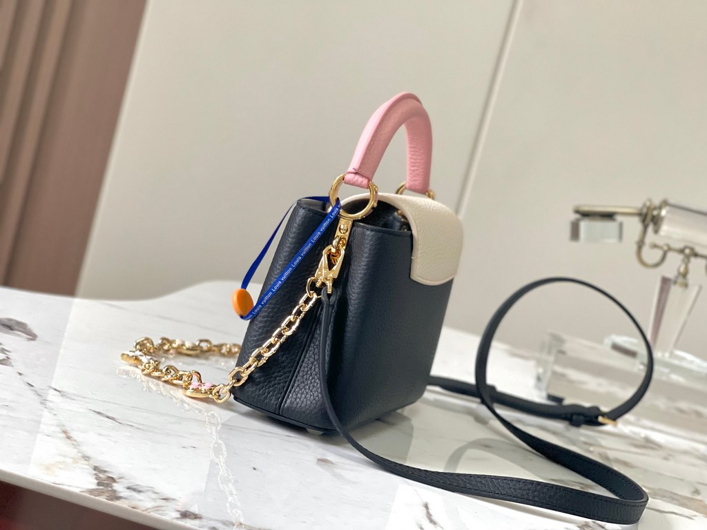 ExtraordinaryM20845 Black with Light Cherry Blossom Pink Floral TricotThis Capucines mini handbag is a soft and feminine piece a Taurillon leather body with a light-colored flap and top handle, and an enameled Monogram f