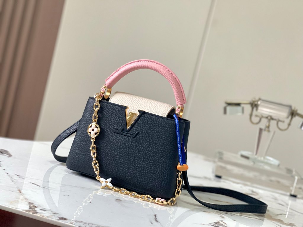 ExtraordinaryM20845 Black with Light Cherry Blossom Pink Floral TricotThis Capucines mini handbag is a soft and feminine piece a Taurillon leather body with a light-colored flap and top handle, and an enameled Monogram f