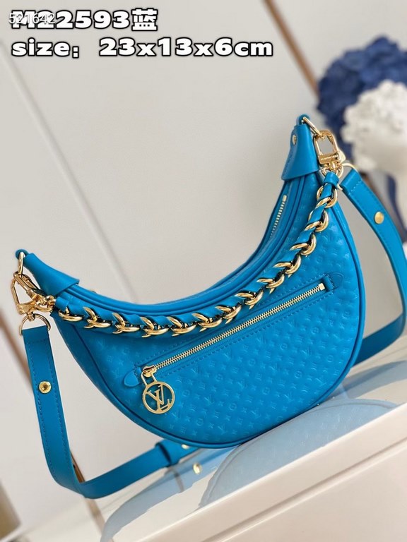 MM22593 BLUE] A Loop bag in cowhide leather with a miniature Monogram pattern. The colorful silkscreened LV monogram logo and Monogram floral pattern create a gentle contrast with the body of the bag. The chain and iconi