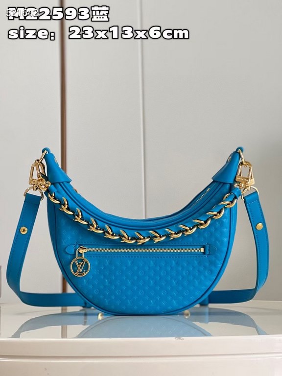 MM22593 BLUE] A Loop bag in cowhide leather with a miniature Monogram pattern. The colorful silkscreened LV monogram logo and Monogram floral pattern create a gentle contrast with the body of the bag. The chain and iconi