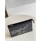 Top [Exclusive N64605] This Pochette Voyage clutch bag encounters the Louis Vuitton seal theme, depicting a wildlife rush in classic Damier Graphite canvas with passport stamp motifs, a tribute to the spirit of free trav